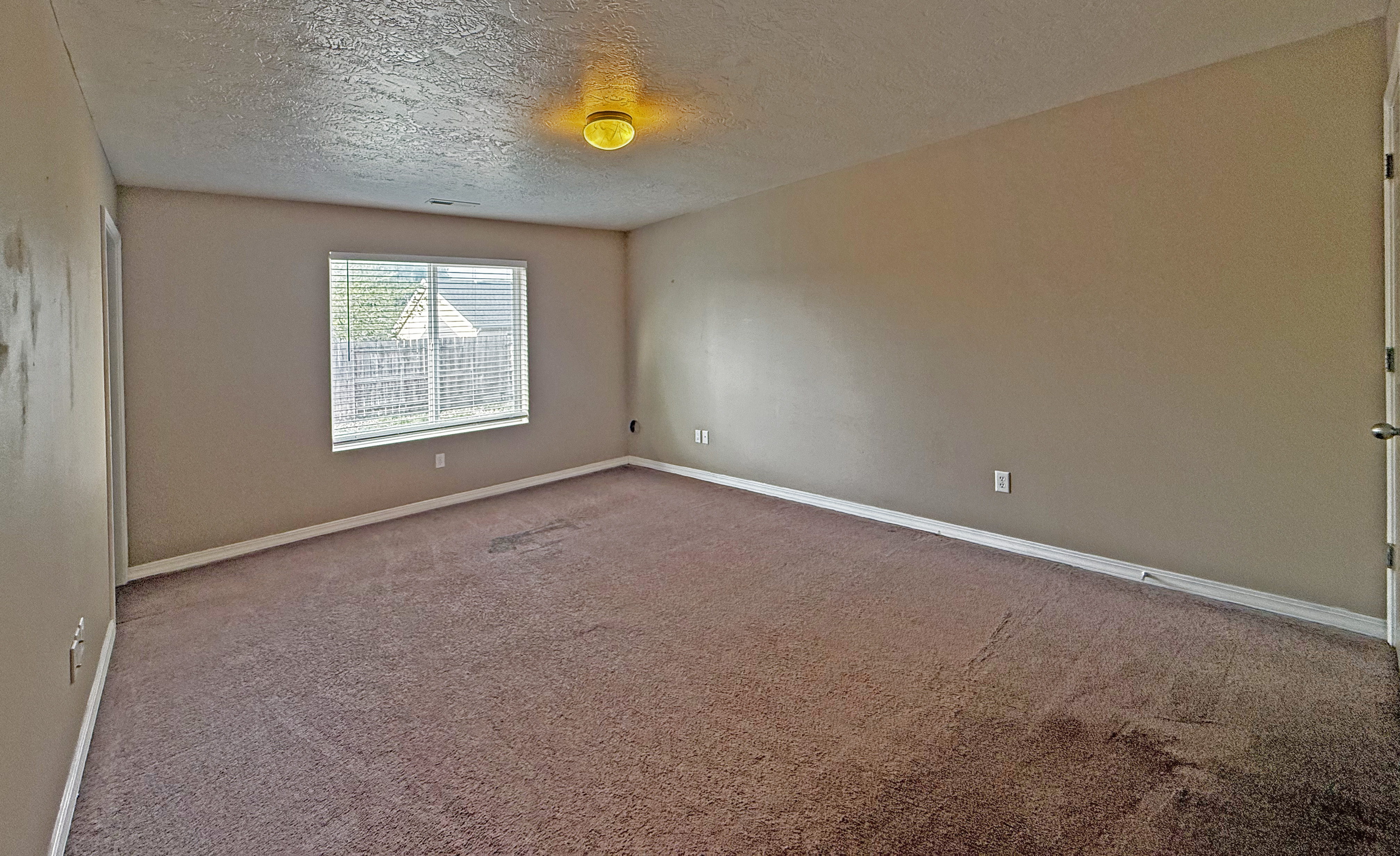 Master bedroom overlooking backyard
